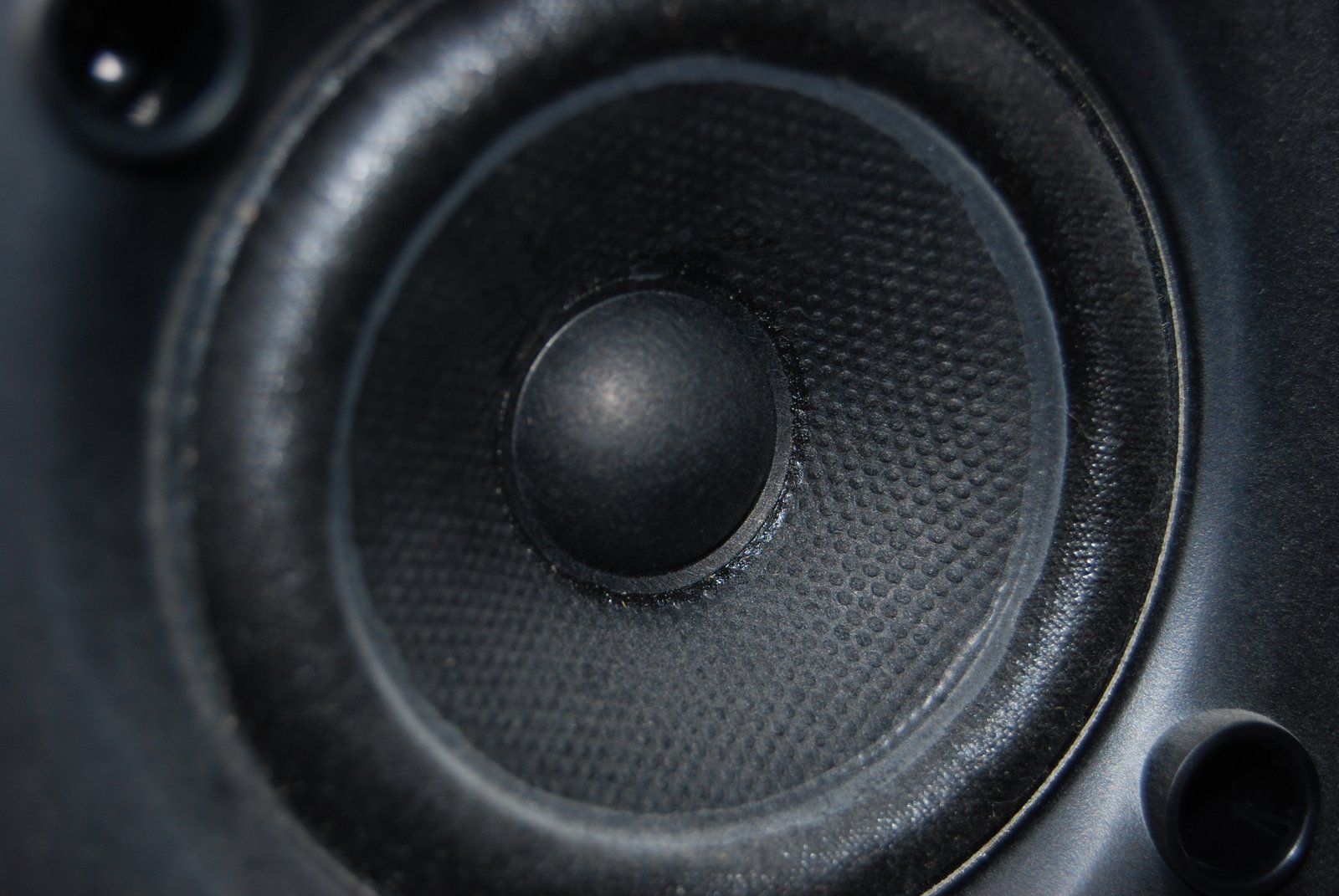 Close-up of a black loudspeaker cone