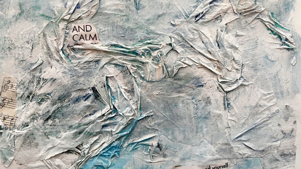 White and pale blue mixed-media collage of crumpled paper with scraps of sheet music and the words And Calm