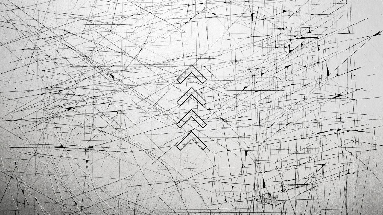 Stacked upward chevrons on a scratched light grey background
