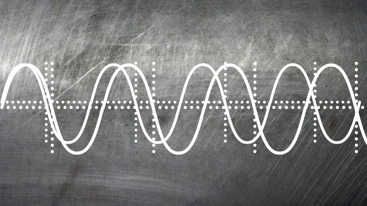 Two slightly offset white sine waves over a brushed metal background