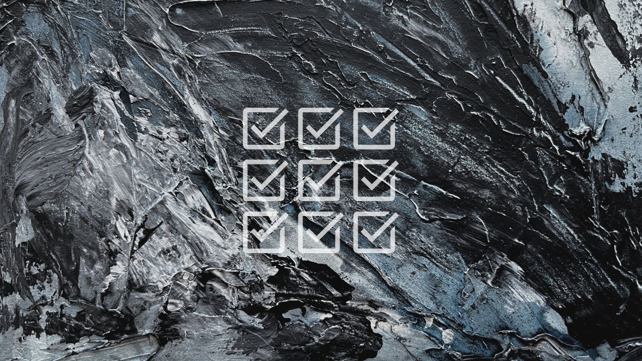 Dark blue and grey abstract painted texture overlaid with a grid of nine ticked checkboxes