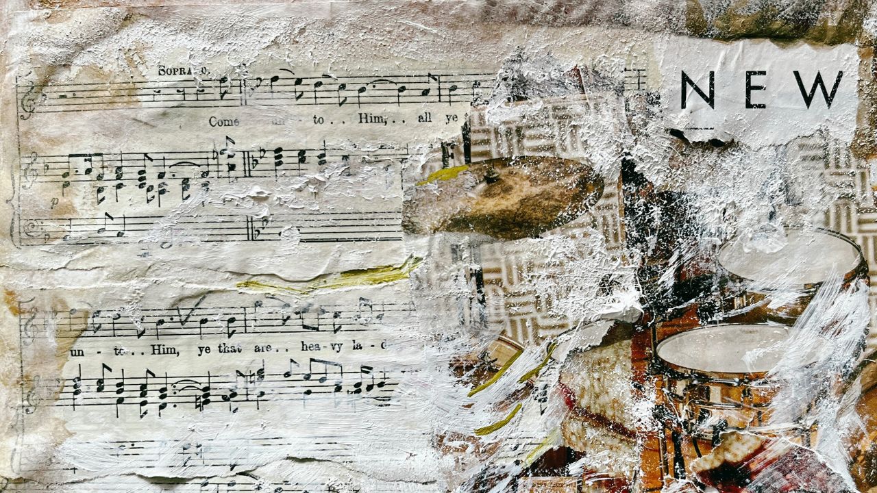 Mixed-media collage of torn sheet music, a drum kit and the word New