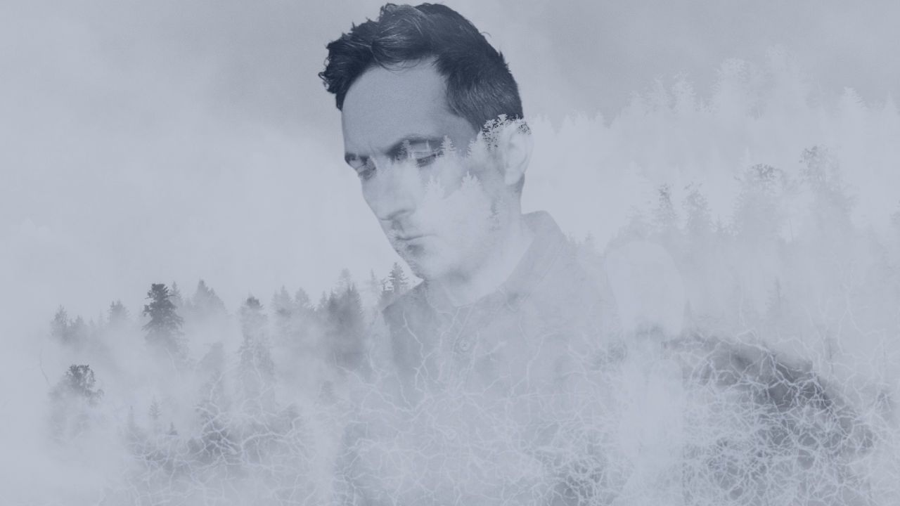Edited press shot of Richard Pryn in a misty double exposure with a pine forest
