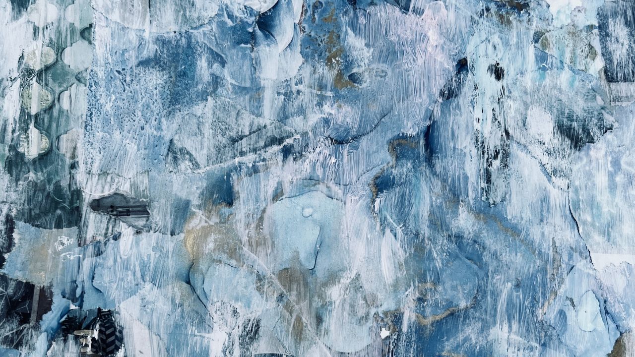 Abstract textured painting in pale blues and white with hints of gold
