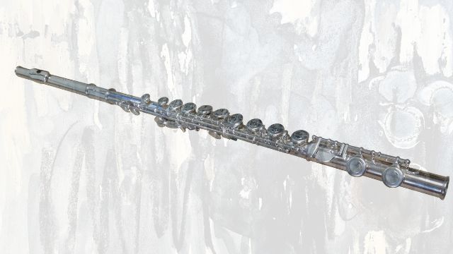A silver concert flute with its keys and head joint
