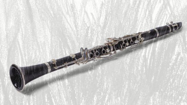 A black clarinet with silver keys and a flared bell