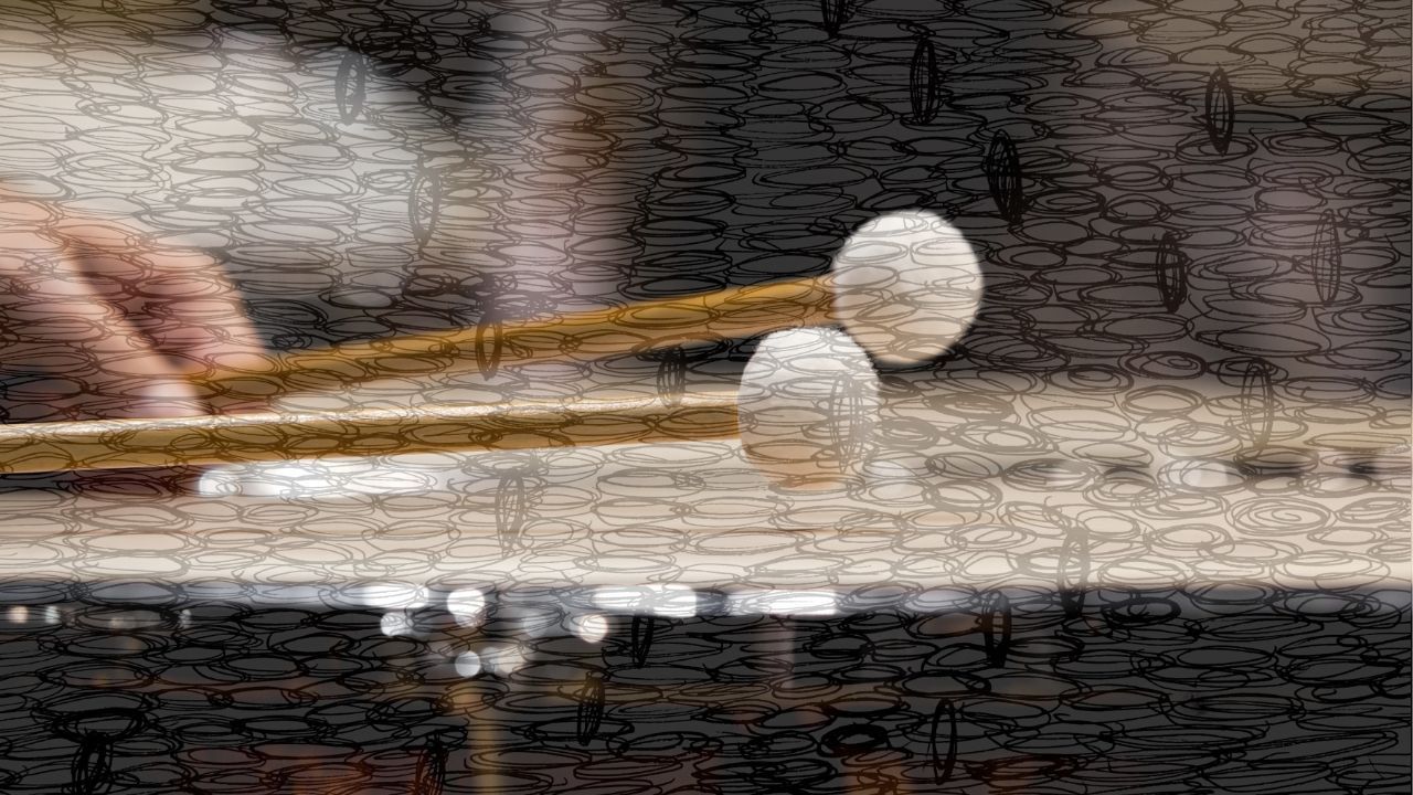 Two mallets playing a tuned percussion instrument, overlaid with ink scribbles