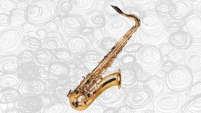 A brass tenor saxophone with its curved neck and bell