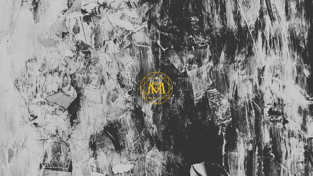 Grey and white abstract painted texture with a gold geometric monogram in the centre