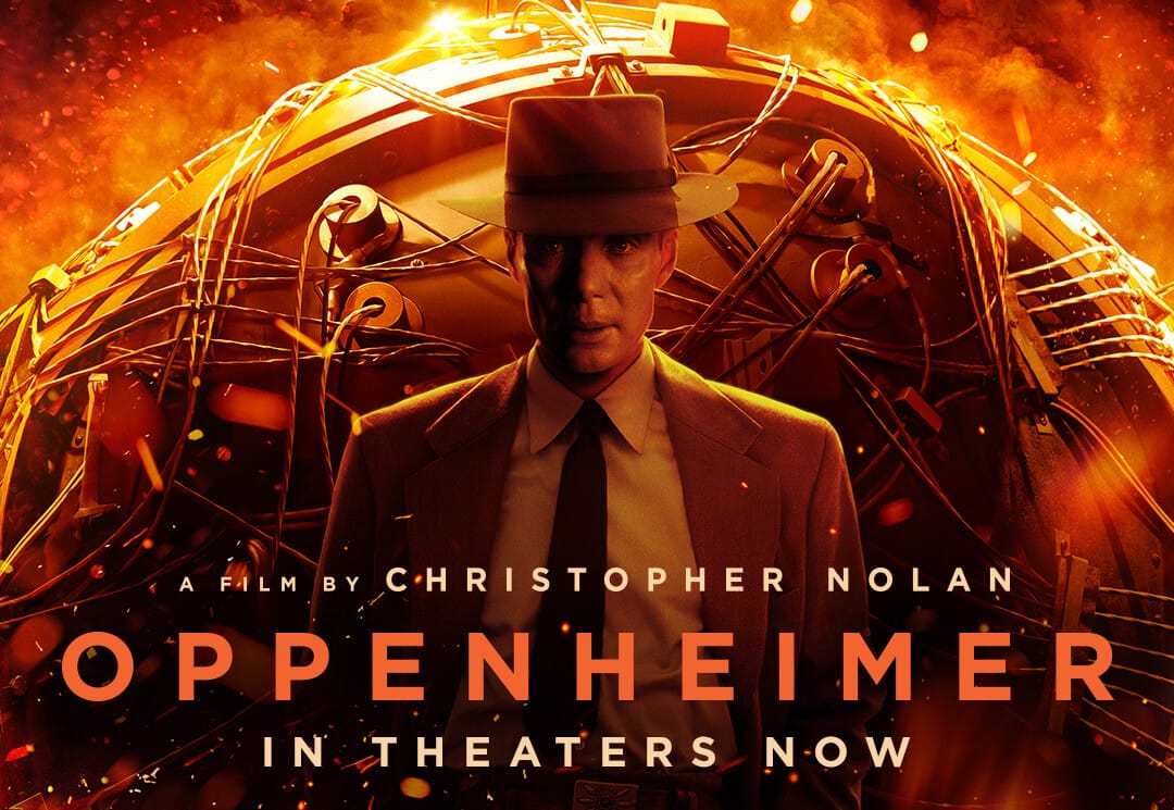 Oppenheimer poster showing Cillian Murphy in a hat in front of the glowing atomic bomb