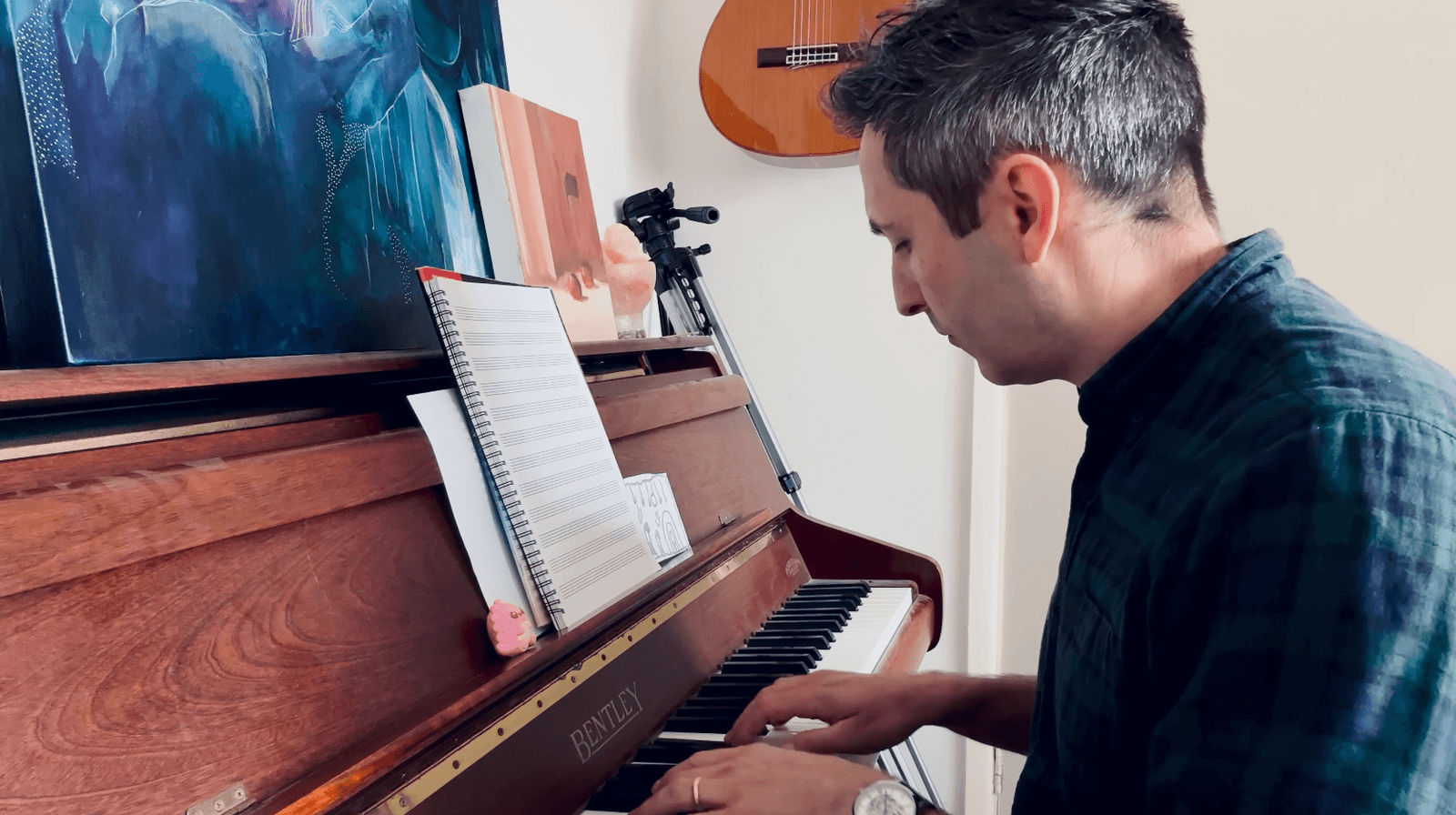 Richard Pryn improvising at an upright piano in his home studio